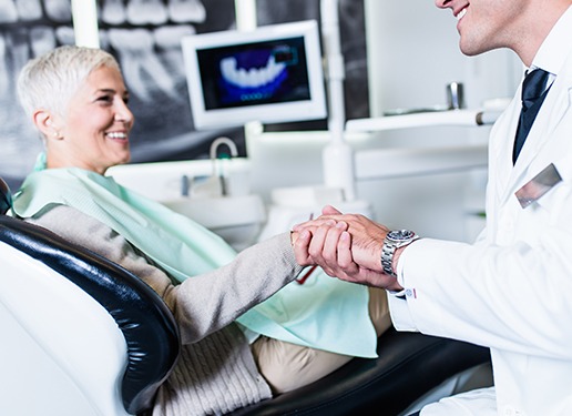 dentist shaking woman's hand