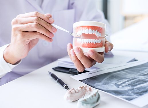 dentist working on dentures