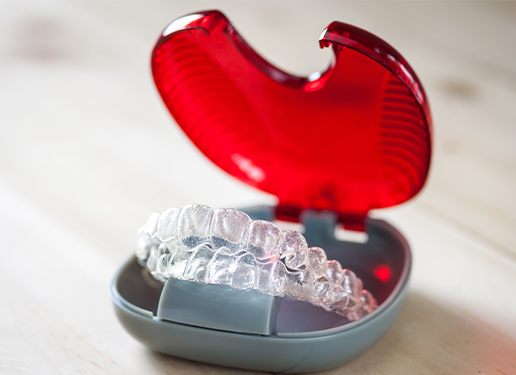 Invisalign tray in red container